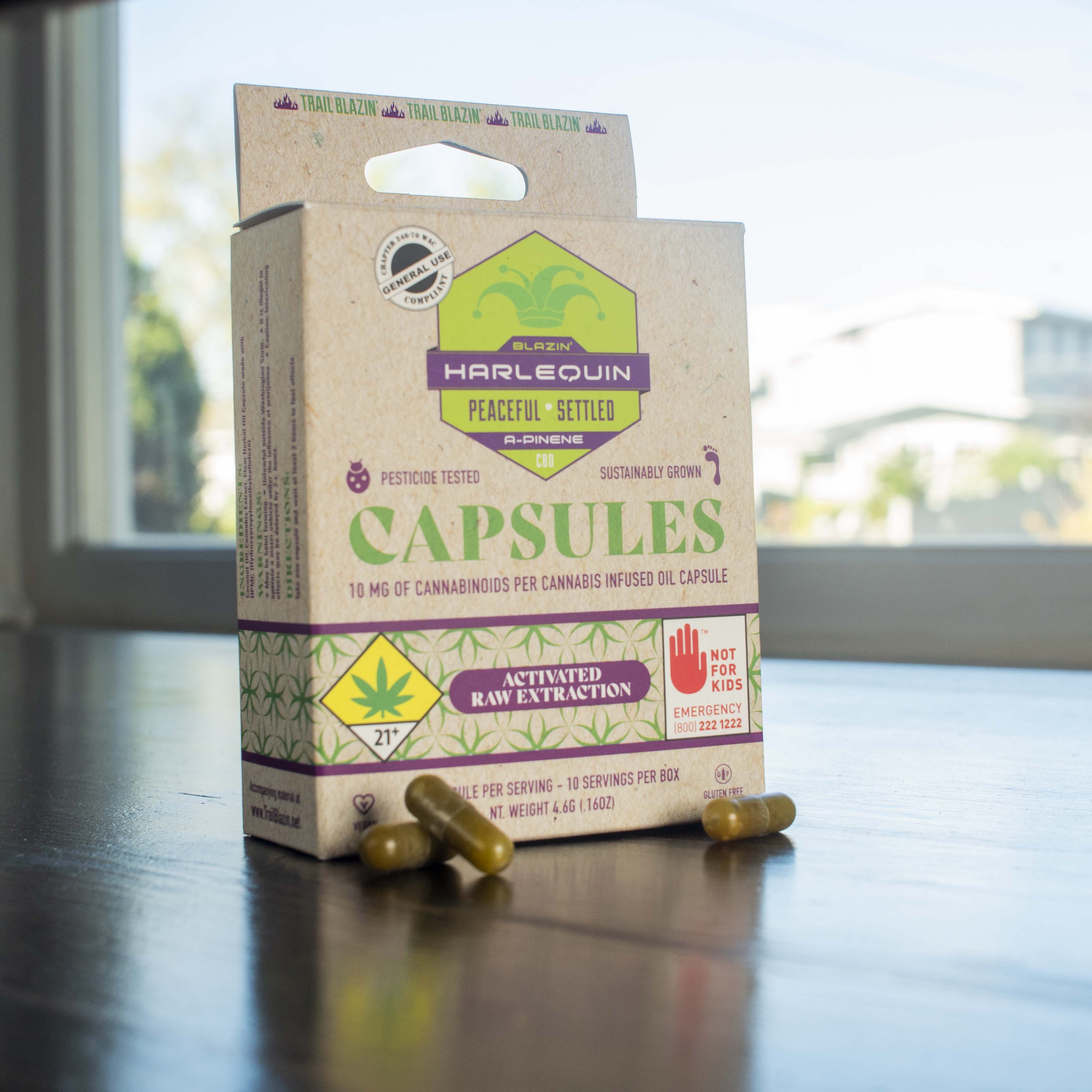 Harlequin capsule box with capsules.